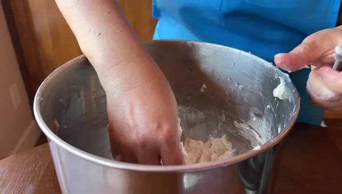 Gently drop the formed fish balls into a pot of cold water to prevent sticking.