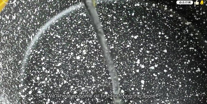 Heat oil in a frying pan. Test the oil temperature by dropping in a piece of apple; it should bubble immediately.