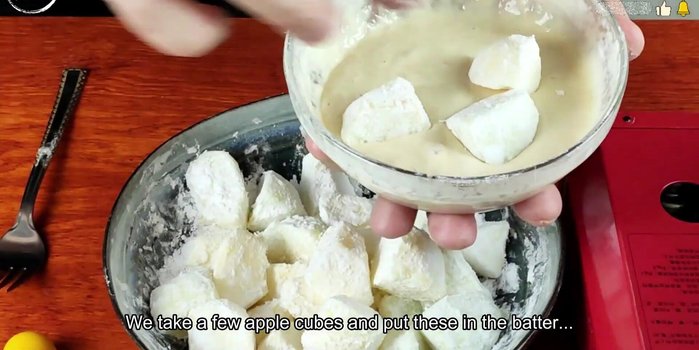 Dip the apple pieces in the batter, ensuring they're fully coated, and then fry until nicely browned.