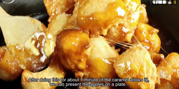 Arrange the caramel-coated apples on a plate. While the caramel is still hot and liquid, use satay sticks to create a spiderweb effect by pulling the caramel into strings.