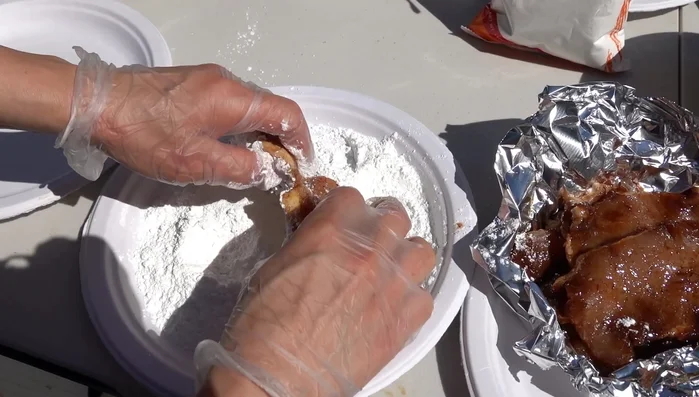 Dip each pork chop in the flour mixture.