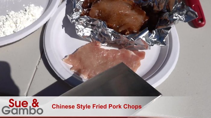 Pound the pork chops to make them thinner using a meat mallet. Use the knife's cutter edge to prevent curling.