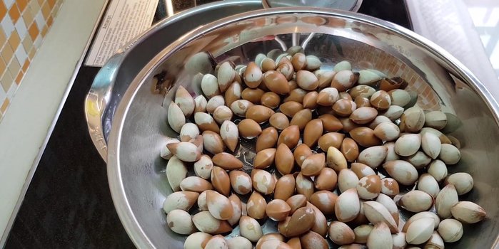 Crack open the ginkgo nuts and remove the inner leaf (optional).