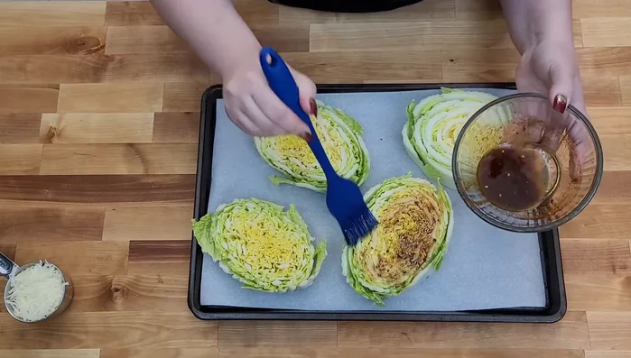 Generously brush the sauce onto each cabbage steak.