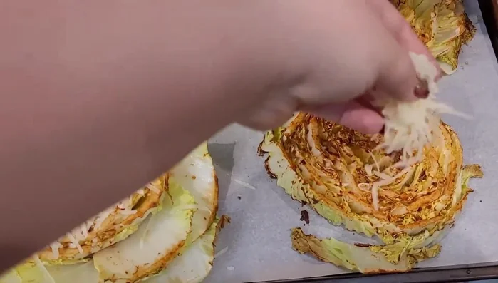 After about 20 minutes of cooking, sprinkle parmesan cheese over the cabbage.