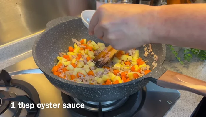 Add oyster sauce, light soy sauce, and dark soy sauce. Mix well.