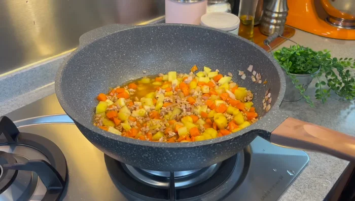 Add water. Bring to a boil, then reduce heat to low, cover, and simmer for 10 minutes.