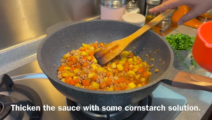 Thicken the sauce with a cornstarch slurry, adding a little at a time until desired consistency is reached.
