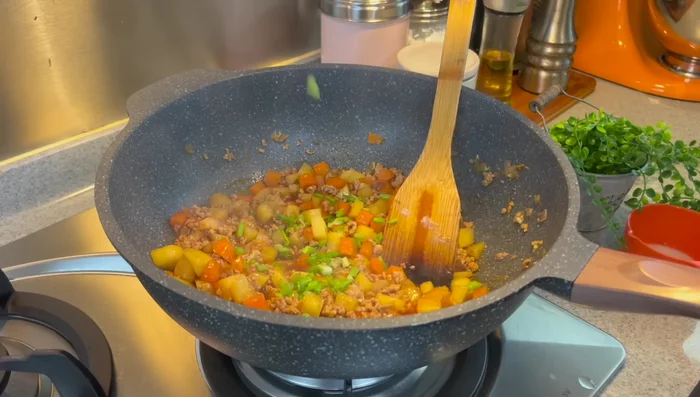 Turn off the heat. Stir in chopped spring onions.