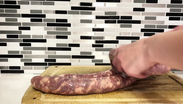 Link sausages: Divide the sausage into equal lengths, pinch, twist, and link together without kitchen twine.