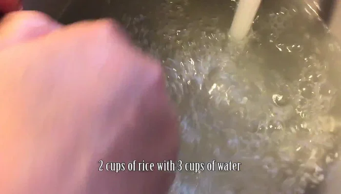 Wash the rice until the water runs clear and put it in the rice cooker to cook.