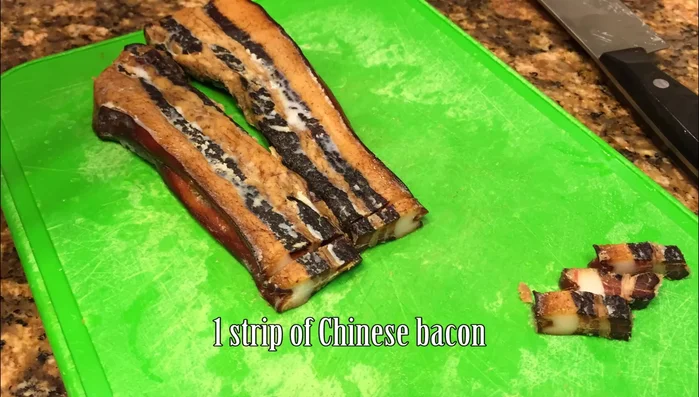 Cut the Chinese bacon into small pieces.