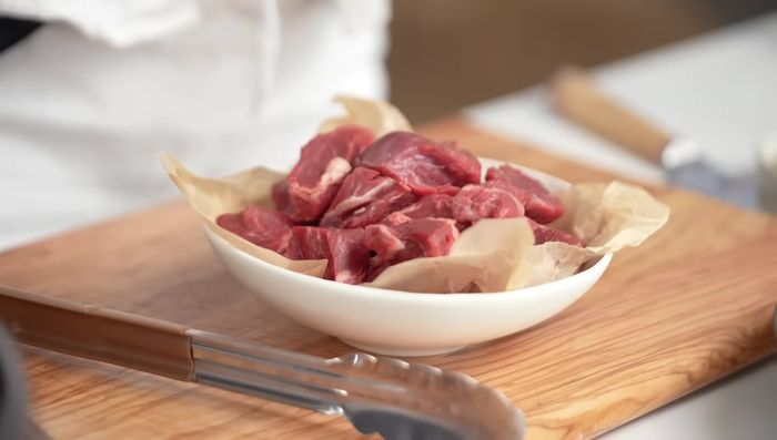 Season beef chunks with salt and sear them in the same pan until browned.