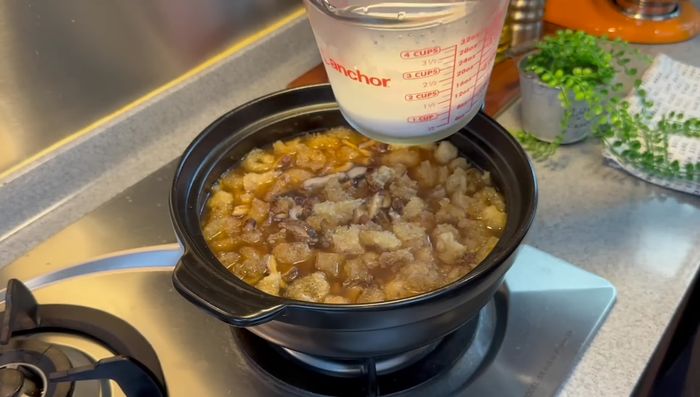 Thicken the soup with a tapioca starch solution (or corn starch).