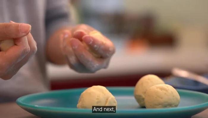 Place sesame paste (or other filling like peanut butter or chocolate) inside each ball.