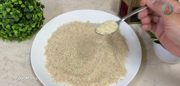 Mix bread crumbs and sesame seeds. [303.039]