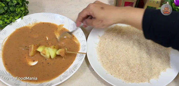 Coat each skewer generously with the sauce, then roll in the bread crumb mixture. [327.68]
