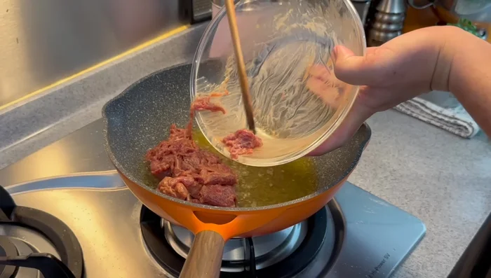 Fry the beef: In the same pan (without reducing heat), add the marinated beef and stir-fry until color changes. Remove from pan.