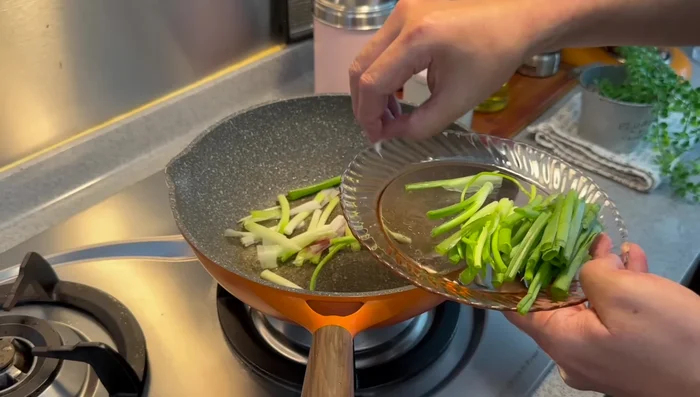 Prepare sauce: In the pan, sauté spring onions and garlic until fragrant. Add water, oyster sauce, light soy sauce, duck sauce, salt, and white pepper. Mix well.