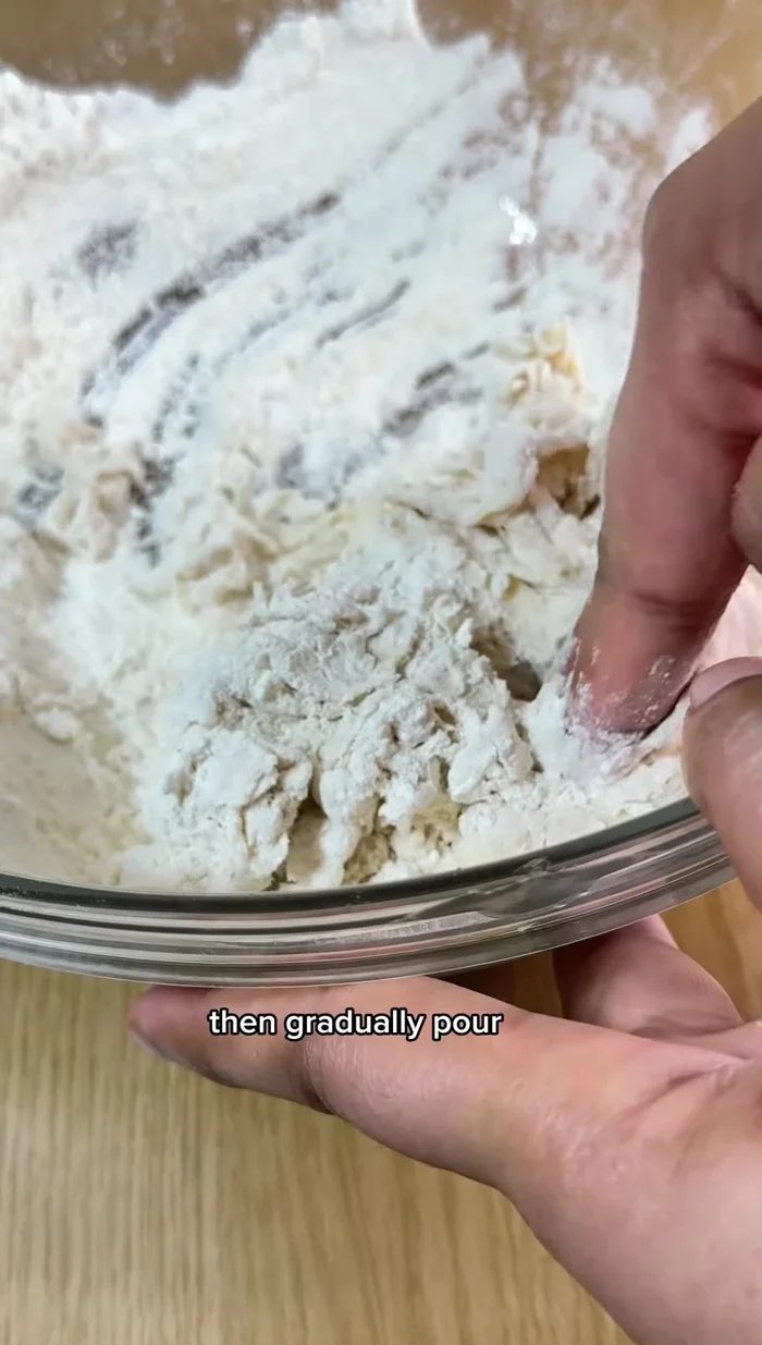 Make the dough: Mix yeast with water and sugar. Add flour and salt, gradually pour in the yeast mixture while stirring. Knead until smooth, cover, and let rest for 10 minutes.