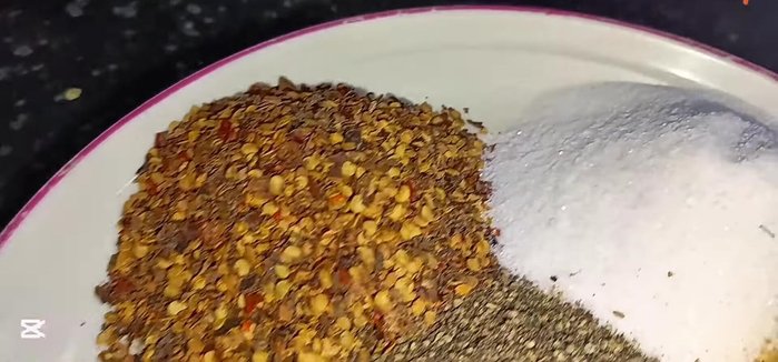 In a large pan, mix dry spices (chili powder, salt, Janice salt, white pepper, black pepper, biryani masala, cumin seeds).