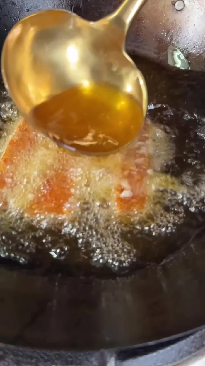 Deep fry the air-fried pork belly until crispy.