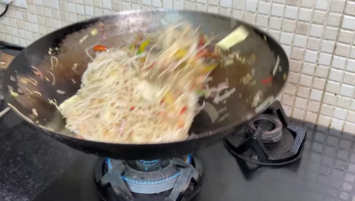 Add butter and sesame oil, tossing to coat the noodles evenly. Continue to toss until heated through and the flavors are well combined.