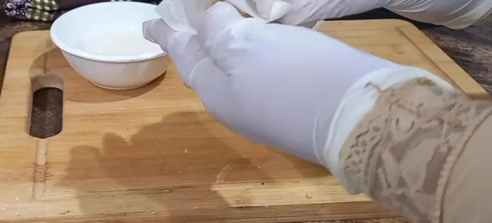 Fold the wrapper into a triangle, sealing the edges tightly.