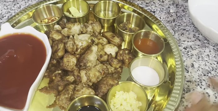 Prepare Manchurian sauce: In a pan, sauté garlic cloves until fragrant. Add ketchup, a little water, and all spices (chicken cube or powder, soy sauce, vinegar, red pepper, black pepper, crushed chili). Simmer slightly.