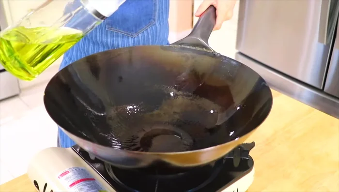 Add about 3 tablespoons of oil to the wok over high heat. Add the beef and stir-fry for about 3 minutes to get a nice sear and smoky flavor.