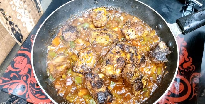Add the fried fish to the cooked vegetables. Mix well.