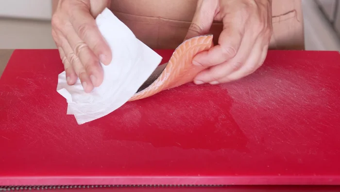 Pat the salmon dry with a paper towel and cut into 1-2 inch cubes.
