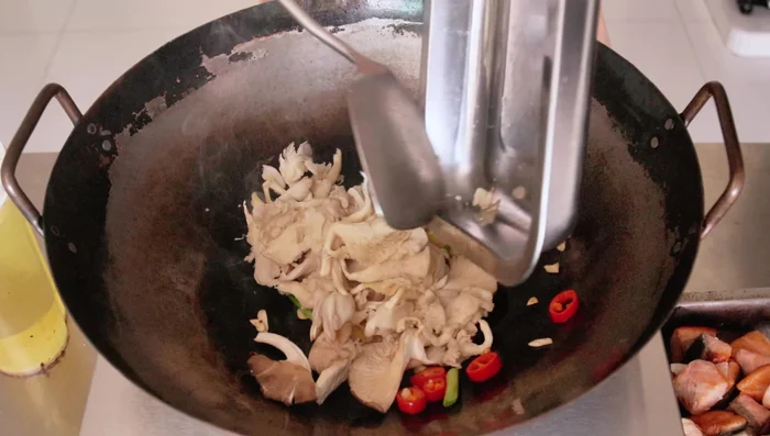 Add mushrooms and fry for about a minute.