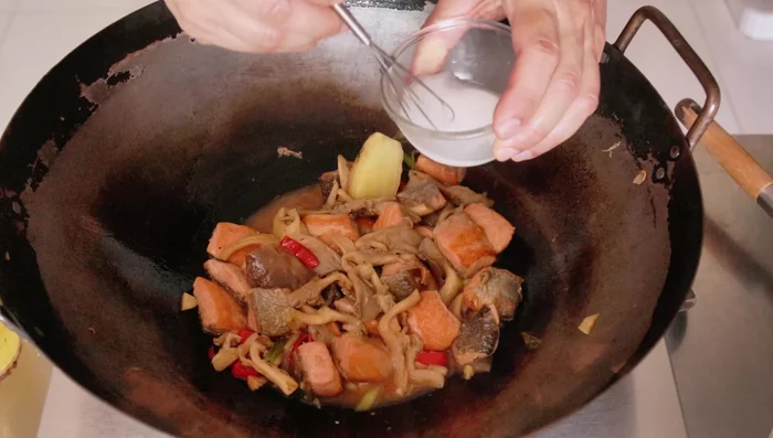 Thicken the sauce with the cornstarch slurry. Add about 1 teaspoon at a time, bringing to a boil after each addition.