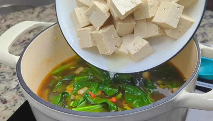 Add tofu cubes (about 1-inch wide). Boil for 2-3 minutes (or skip cooking if using soft tofu; add just before turning off the heat).