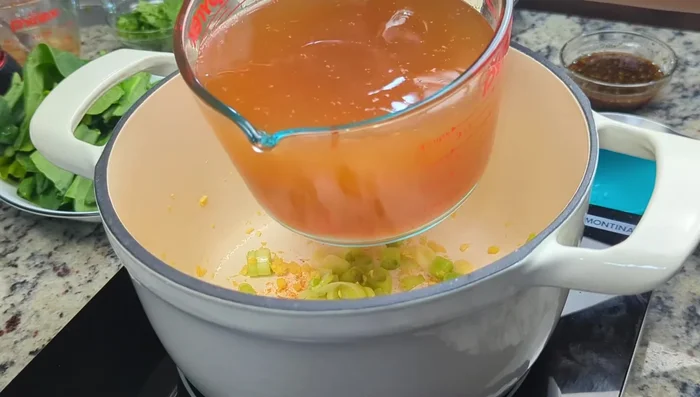 Add 4 cups of vegetable stock (or water) and bring to a boil.