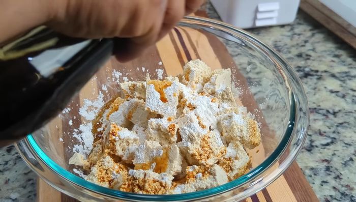 In a bowl, add light soy sauce and sesame oil. Mix well.