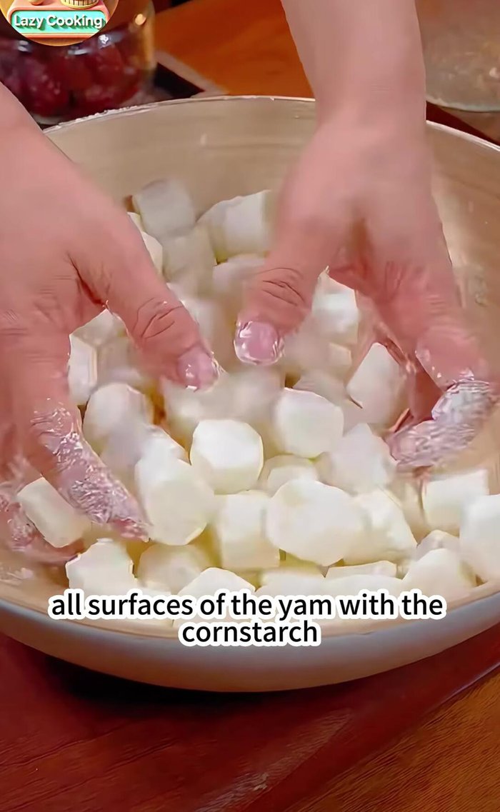 Heat oil in a pan to 60% temperature. Add the yam; don't move it initially to allow it to set.