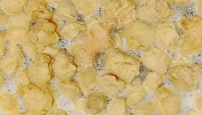 Boil soya chunks until softened. Squeeze out excess water.