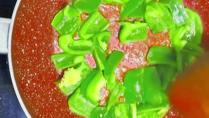 Add chopped capsicum and onion and sauté on low flame.