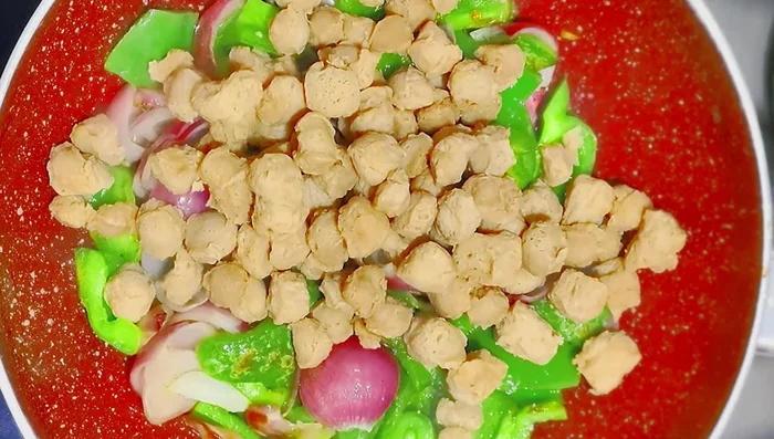 Add the boiled and squeezed soya chunks.