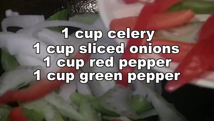 Add celery, onion, red pepper, and green pepper. Stir-fry briefly.