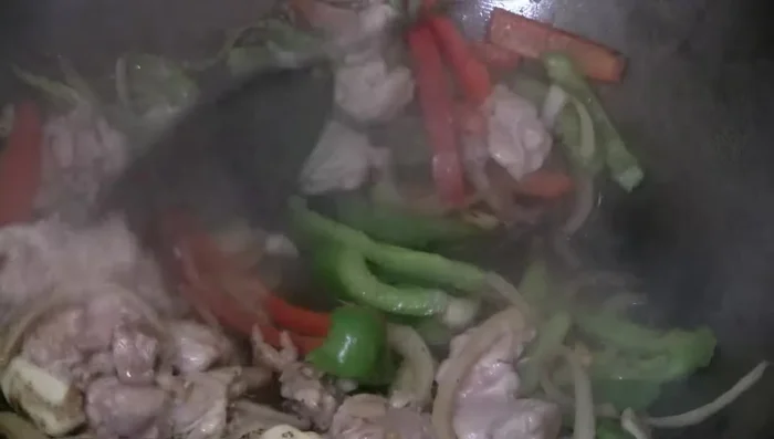 Return chicken to wok. Add Shaoxing wine (optional).