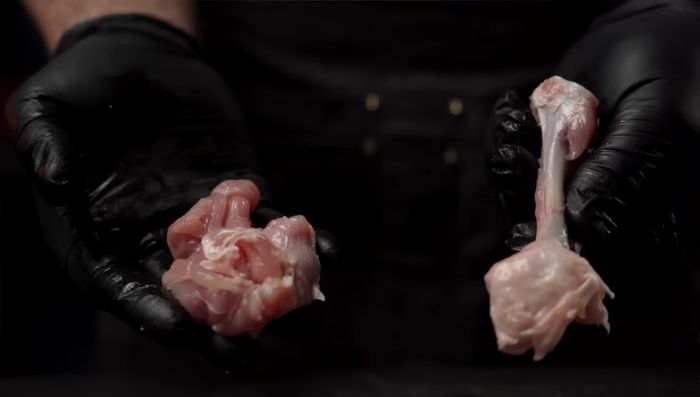 Debone chicken drumsticks. Make a small incision along the drumstick, use fingers to separate meat from bone. Rip off as much as possible and make additional cuts to remove stubborn bits.