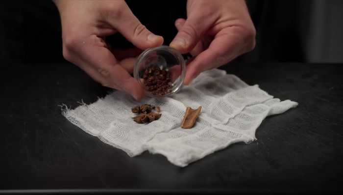 Make a spice bag: Combine star anise, cinnamon bark, citron peppercorns, fennel seeds, and a crushed bay leaf in a piece of cheesecloth; tie it up with twine.