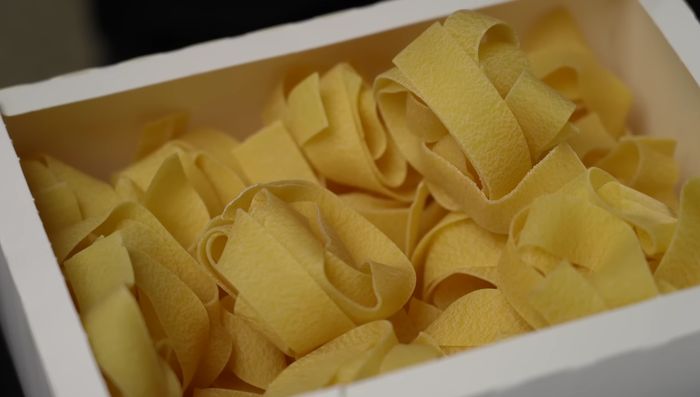 Cook Italian belt pasta until al dente; drain.