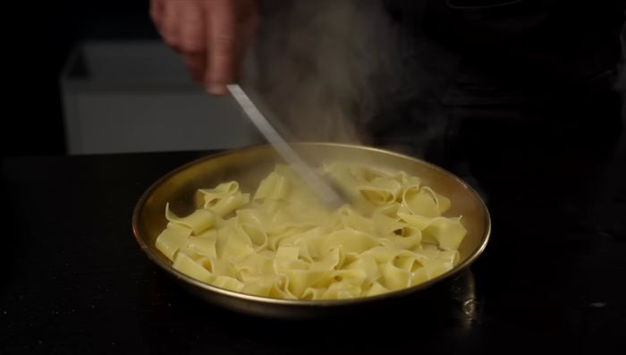 Spread cooked noodles on a large serving platter. Pour chicken mixture over the noodles. Garnish with cilantro.