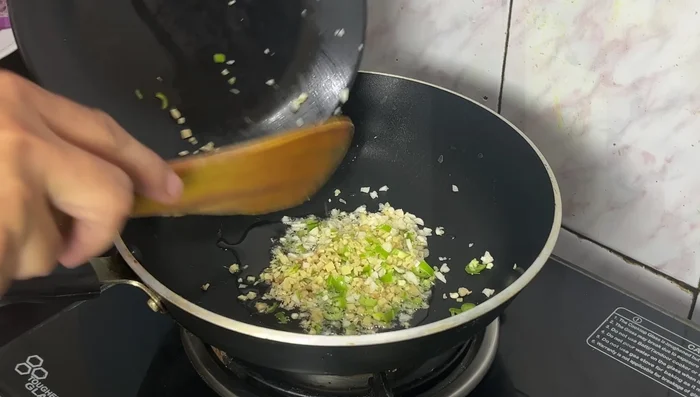Prepare the sauce: Saute ginger, garlic, and green chilies in oil until fragrant. Add sliced chilies and bell peppers; cook until slightly softened.