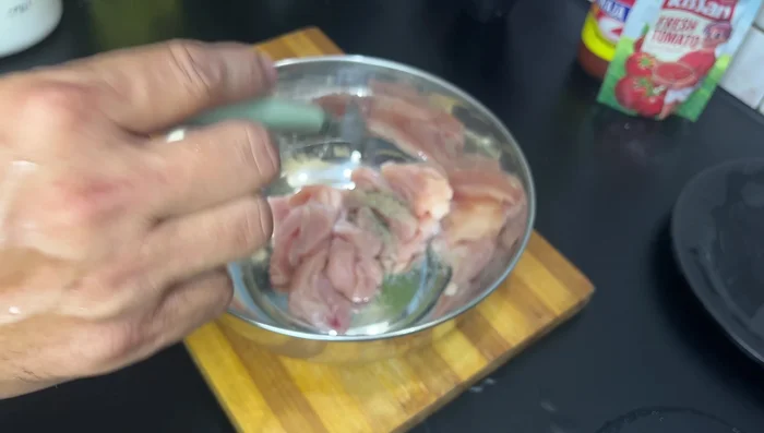 Marinate chicken with salt, black pepper, white pepper, flour, and cornflour. Add water to create a slightly liquid consistency.
