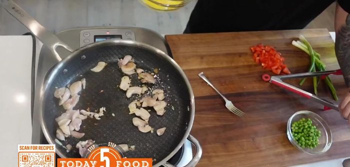 Immediately add the cooked jasmine rice to the pan, mixing it with the wet egg.